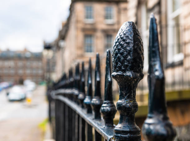 A close-up of black painted wrought iron railings on a street in Edinburgh's historic Georgian New Town.