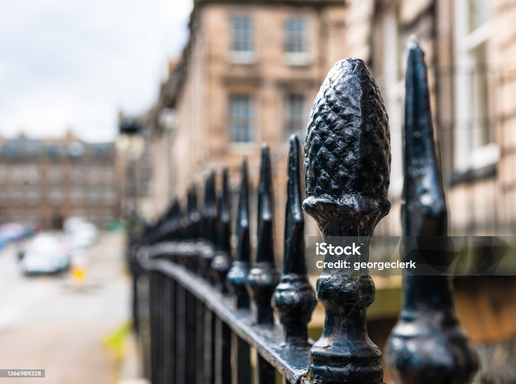 Old fashioned wrought iron railings in Edinburgh's New Town A close-up of black painted wrought iron railings on a street in Edinburgh's historic Georgian New Town. Macrophotography Stock Photo