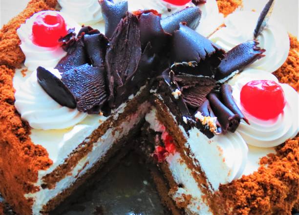 Sweet  Round Cake With Red Cherry .