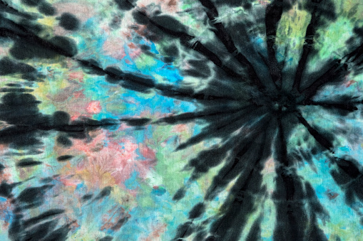 Close-up of a colorful Tie Dye pattern on a textile. Can be used as a background. Tie Dye pattern was created by the photographer.