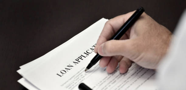 istock Loan Contract Document on Desk with Black Pen 1366997573