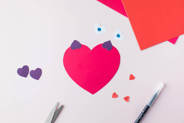 istock DIY and children's creativity. Step by step instructions on how to make an owl valentine card with hearts. Step 3 1366999431