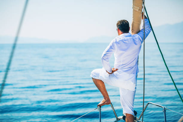 istock Man sailing with sailboat 1367000112