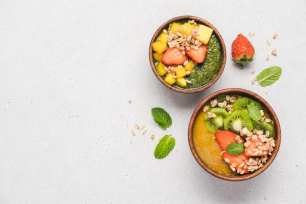 istock Kiwi and mango smoothie wooden bowls 1367002347