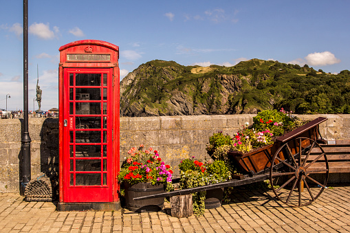 Red traditional English telephone box. Ilfracombe, North Devon, England, UK.