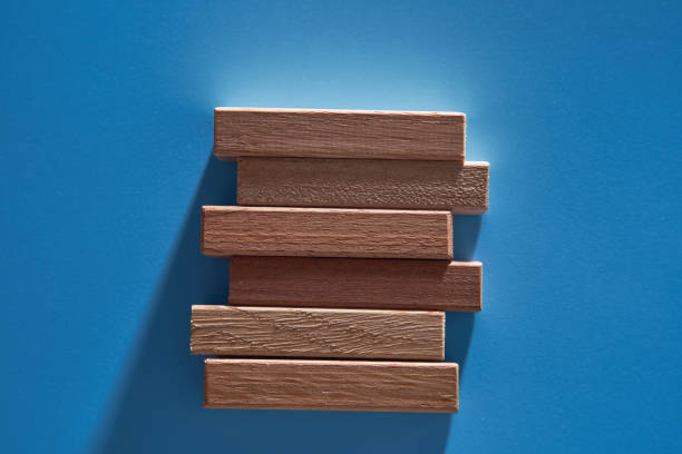 stack of wood block on blue background
