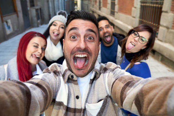 istock Smiling diverse friends taking selfie in alley 1367003235