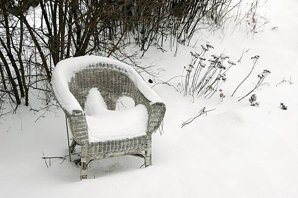 istock Wicker Chair Outside in Snow 136700369