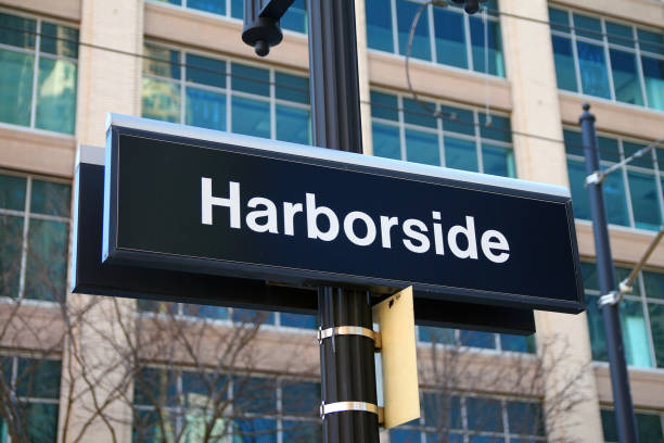 Harborside black and white sign on the station on the light rail path