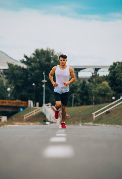 istock Fit man running in the city 1367005723
