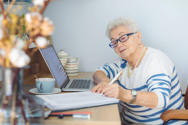 istock Senior woman at home 1367011827
