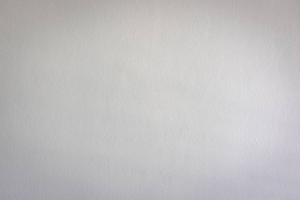 istock Old white cement wall textured background with dark vignette at the edge. 1367012065