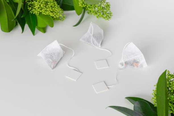 Set of triangle infusion tea bag with tag on white background. Space for text. Mockup. Set of triangle infusion tea bag with tag on white background. Space for text. Mockup. High quality photo food sample cups stock pictures, royalty-free photos & images
