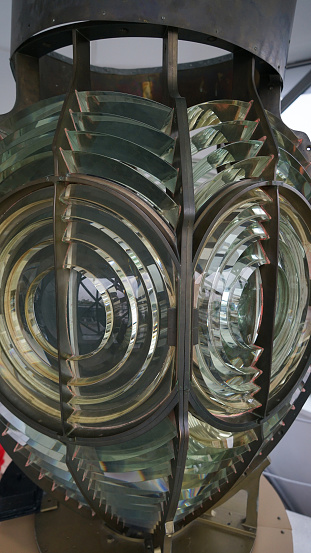 Fresnel lens is a type of composite compact lens in lighthouse. Close image of the glass prisms of lamp of lighthouse.