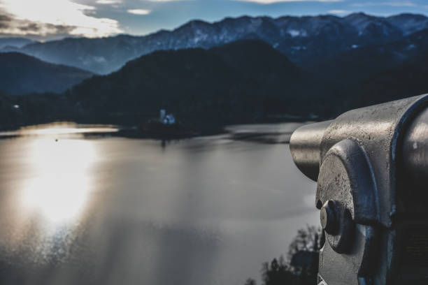 istock Binoculars watching the lake house 1367013793