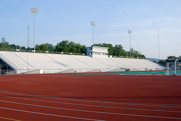 istock American Football Stadium Bleachers Empty in Sunlight 136701388