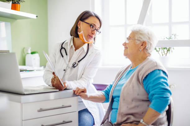istock Doctor consulting her patient 1367014085