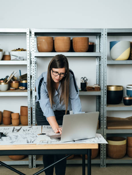 istock Female Furniture Designer Working on a Laptop Computer at her Office 1367015592