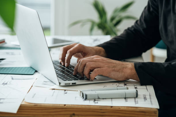 istock Close Up Photo of Architect Hands Using Laptop Computer for Construction Project 1367015673
