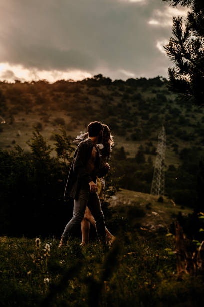 istock Happy romantic couple dancing open air under sunset sky 1367015883