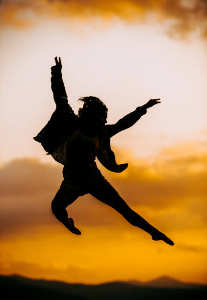 istock Cool woman dancer jumping in mid air making a nice pose 1367015952