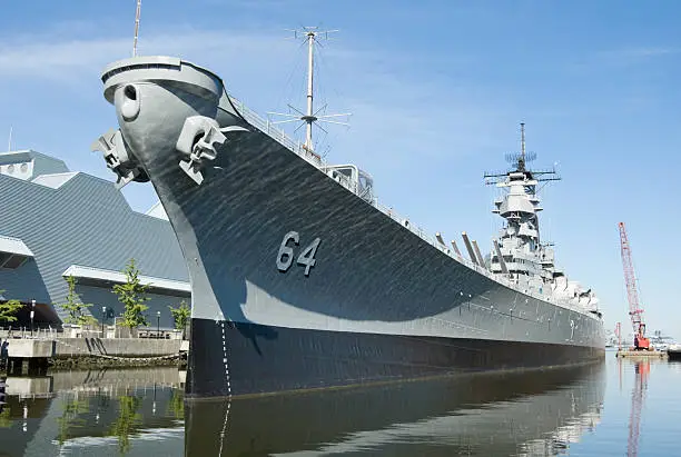 Battleship docked in Norfolk, VA, U S Navy WW II vintage USS Wisconsin at harbor as a tourist attraction. More views: