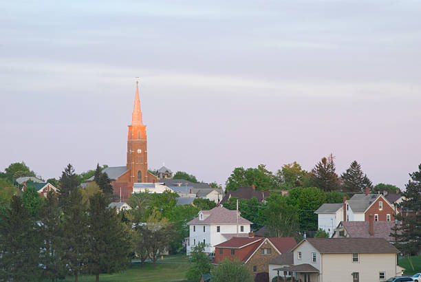 Church steeple in a small town lit by the setting evening sun, Pennsylvania, PA, USA.