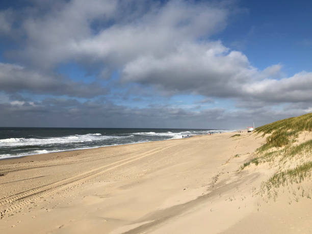 istock scenic autumn sandy beach with waves and dunes in Sylt 1367017696