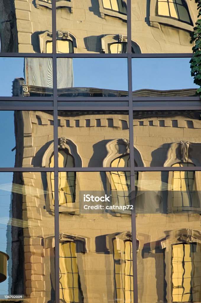 Mirror Reflected City Building Abstract City building reflected and distorted in mirror window wall across the street; natural image, no manipulating filters. Abstract Stock Photo