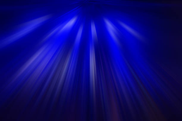 Radial blue rays on a dark, abstract background. Background for design.