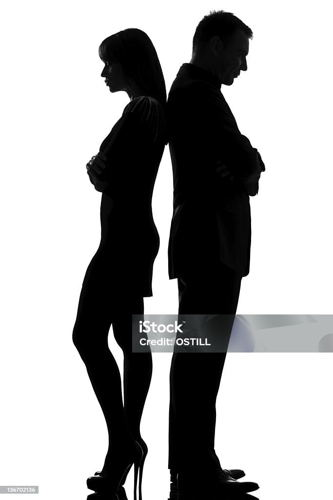 one couple dispute conflict man and woman sad one caucasian couple standing back to back dispute conflict  man and woman sad in studio silhouette   on white background Back To Back Stock Photo