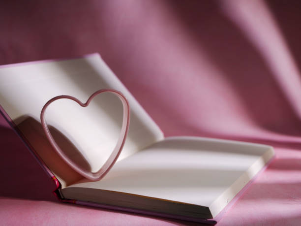 istock Diary with pink loveheart on pink background 1367021522