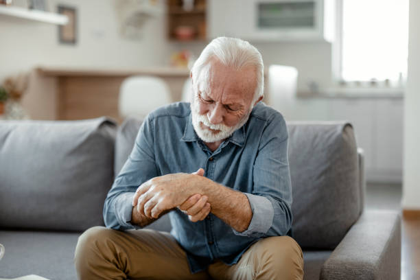 istock Senior man massage his hand with wrist pain 1367021537