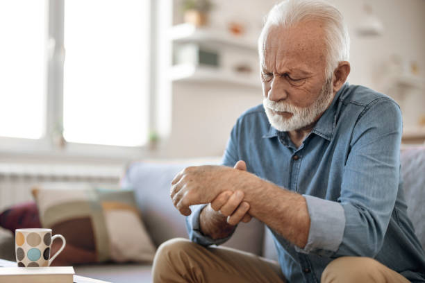 istock Senior man massage his hand with wrist pain 1367021578