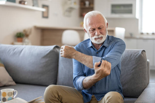 istock Elderly Man With Elbow Pain 1367021758