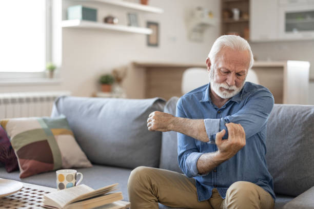 istock Elderly Man With Elbow Pain 1367022330