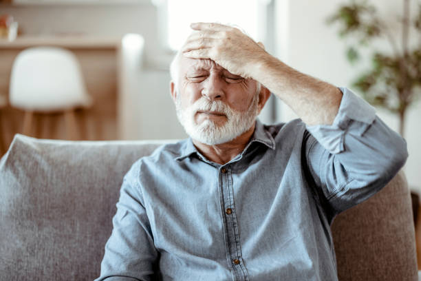 istock Senior man suffering from headache 1367022386