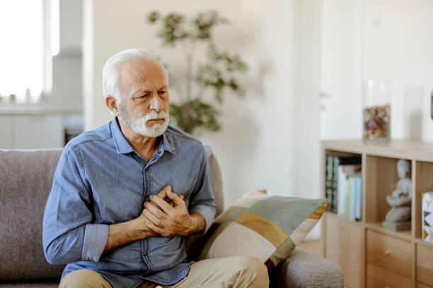 man with heart attack - chest pain imagens e fotografias de stock