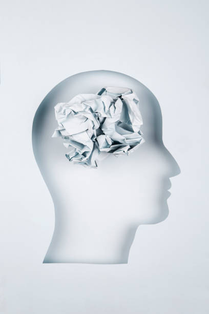 istock Human head in paper cut style with crumpled paper 1367025603