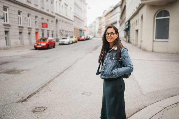 istock Woman walks down the street 1367025703