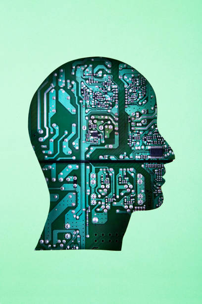 Human head in paper cut style on circuit board