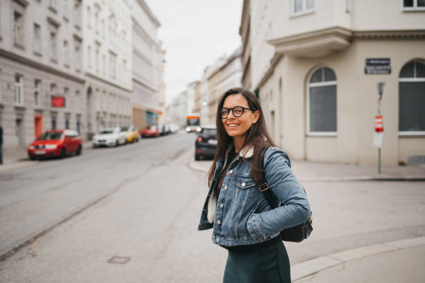 istock Woman walks down the street 1367025838