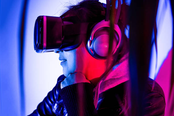 istock Woman immersed in virtual reality with VR glasses 1367026001