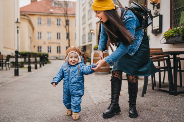 istock Mom and Baby first steps outside 1367027031