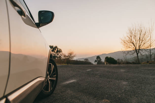 istock Side view of a car at sunset 1367028764