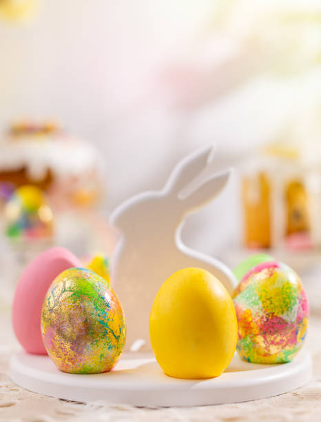 istock Easter composition with colorful Easter eggs on rabbit dessert plate. Traditional Easter treat 1367031339