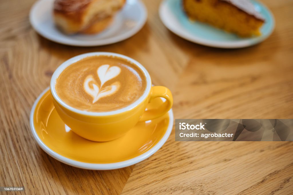 Latte Art On Wooden Table Coffee - Drink Stock Photo