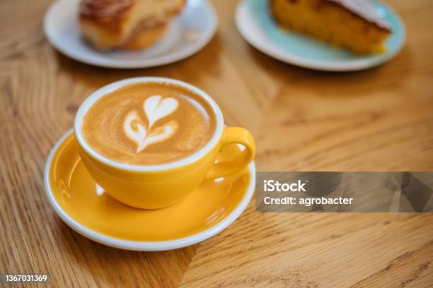 Latte Art On Wooden Table Stock Photo - Download Image Now - Coffee - Drink, Morning, Coffee Cup