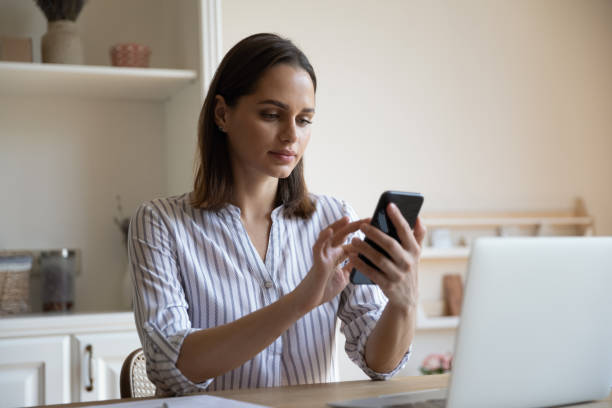istock Focused millennial business woman engaged in digital internet communication 1367031435