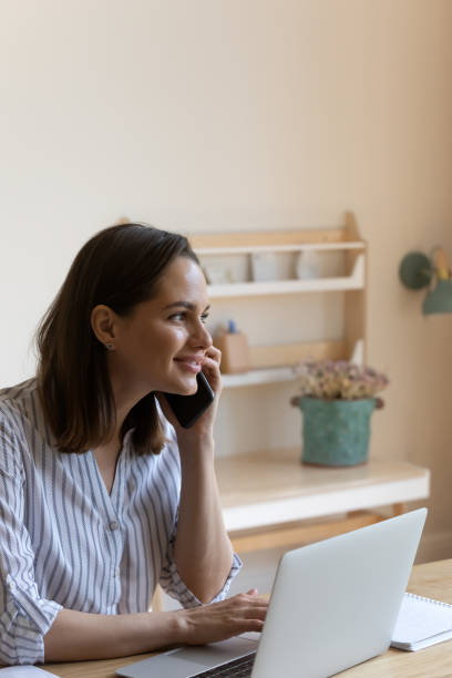 istock Happy positive gadget user woman enjoying wireless communications 1367031437